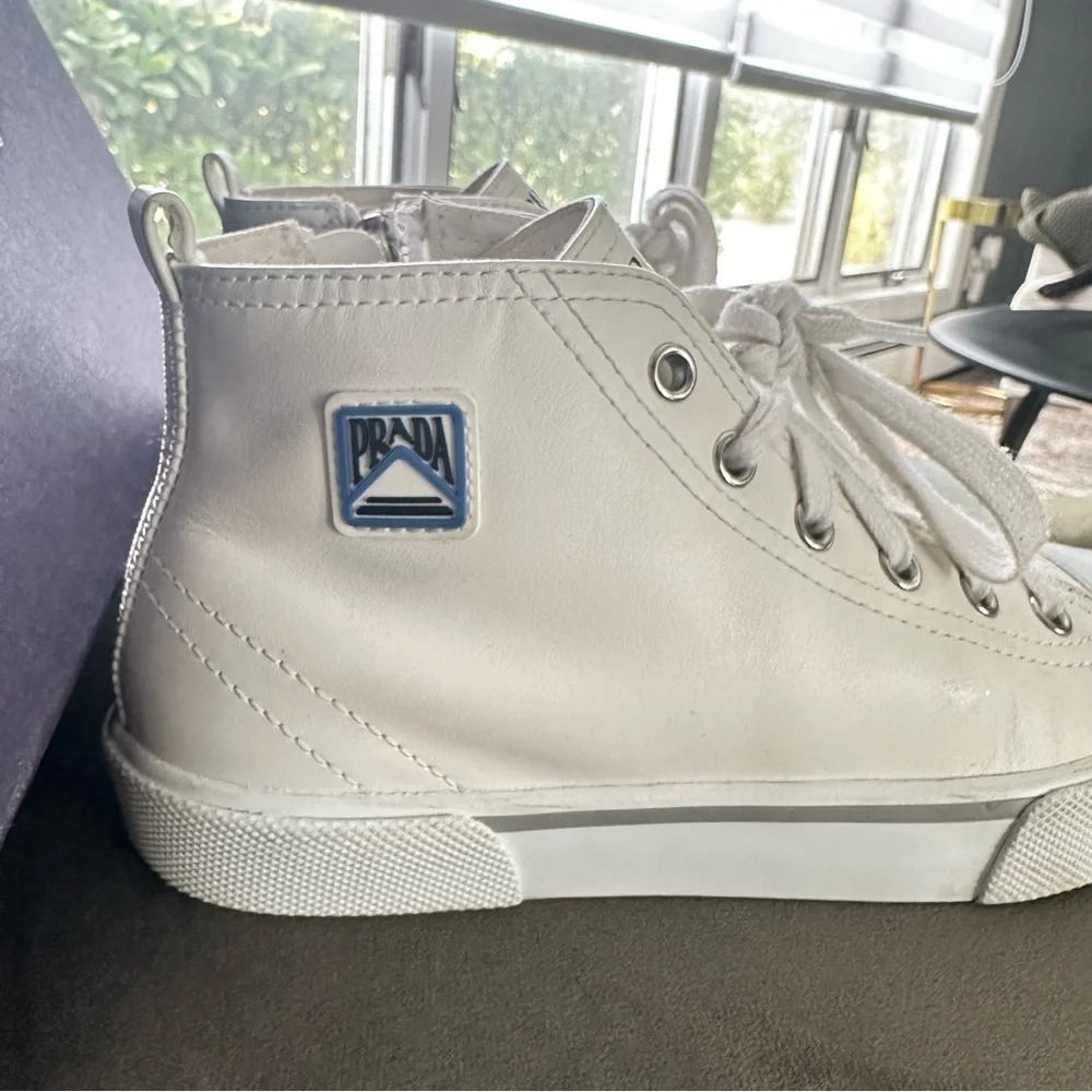 PRADA all white leather high top sneakers size 34 with original box on real real